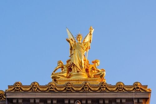 Gold sculpture on top of Paris Opera, taken on a spring morning with perfect blue sky and no people