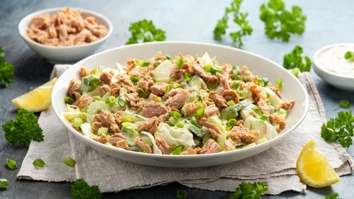 Tuna salad with avocado, celery, spring onion and iceberg lettuce. Tasty healthy food